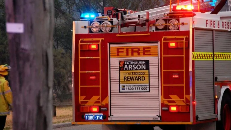 House fire rages in dense suburb south of Perth as fire crews battled to extinguish flames