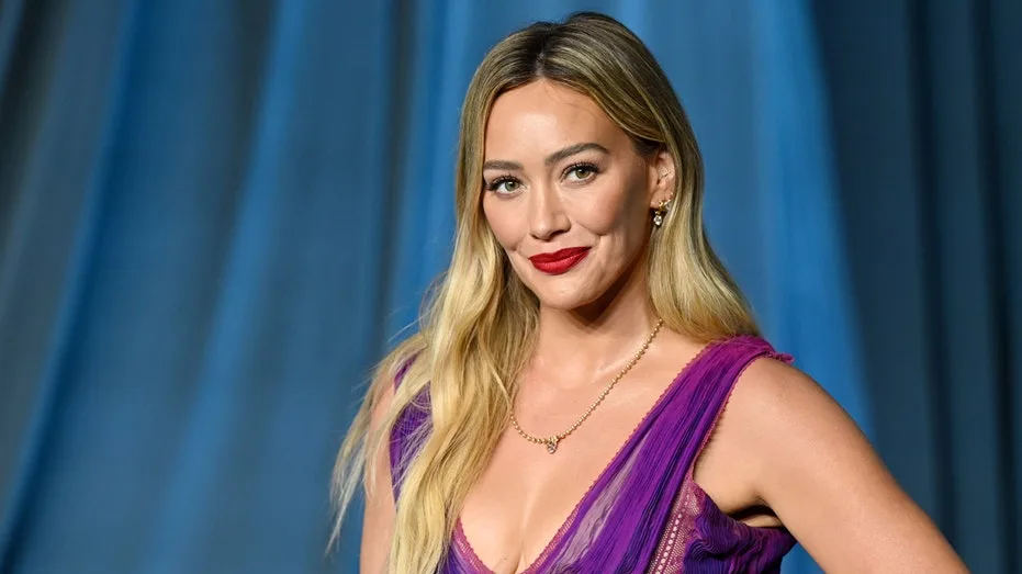 Hilary Duff flaunts figure in yellow swimsuit on girls' trip as 'toxic mom group' drama resurfaces