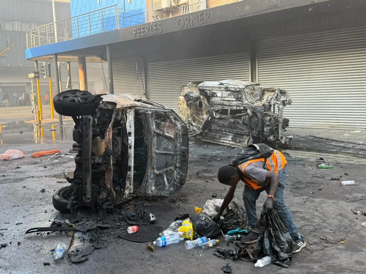 Situation turns volatile in Durban as anti-illegal immigration protesters torch several vehicles and looted shops