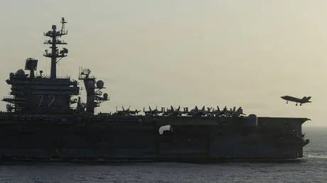 Troubled US aircraft carrier heads home after protracted deployment – media