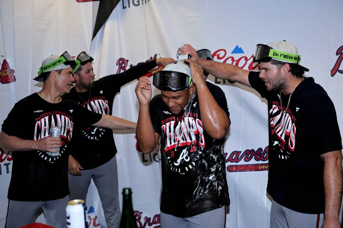Braves clinch NL East crown and help Red Sox punch playoff ticket