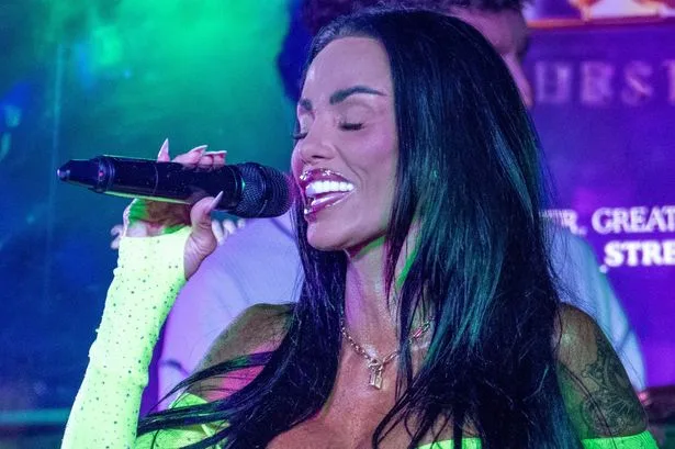 Katie Price flashes wedding ring in eye-popping leotard as husband languishes in jail