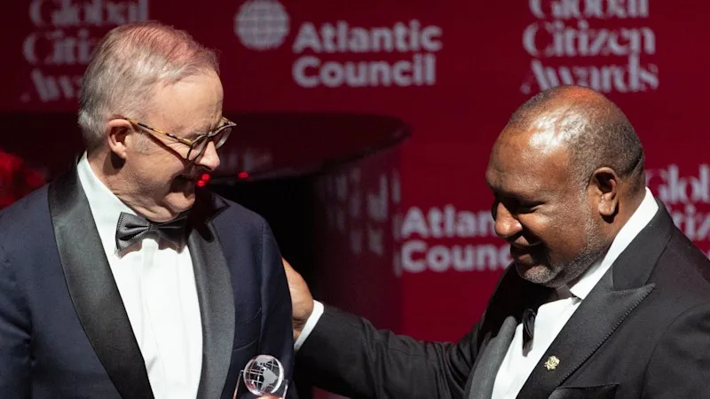 PM mingles with movie stars as he collects his global citizen gong