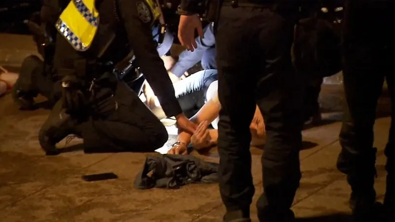 Police rescue drowning suspect from river