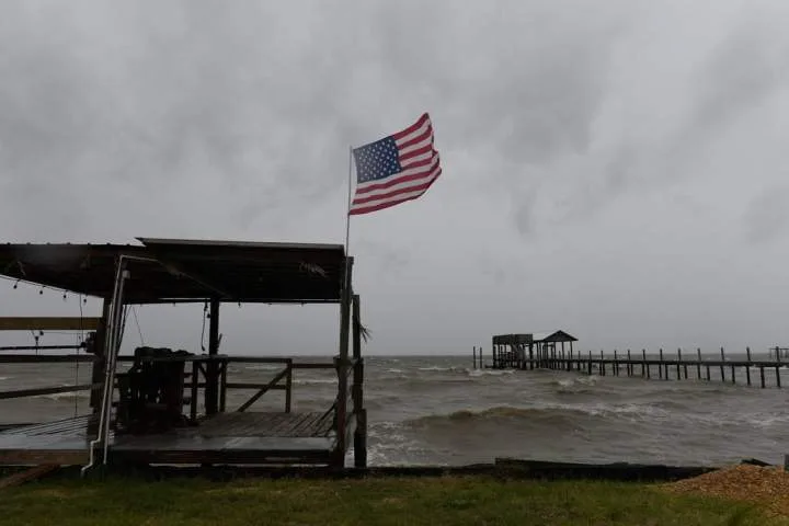 Isaias weakens but flash flooding threat persist as hundred of thousands grapple with power outages