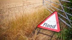 Downpours to continue for UK with risk of flash flooding