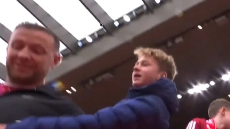 Liverpool fan snatches shirt from kid