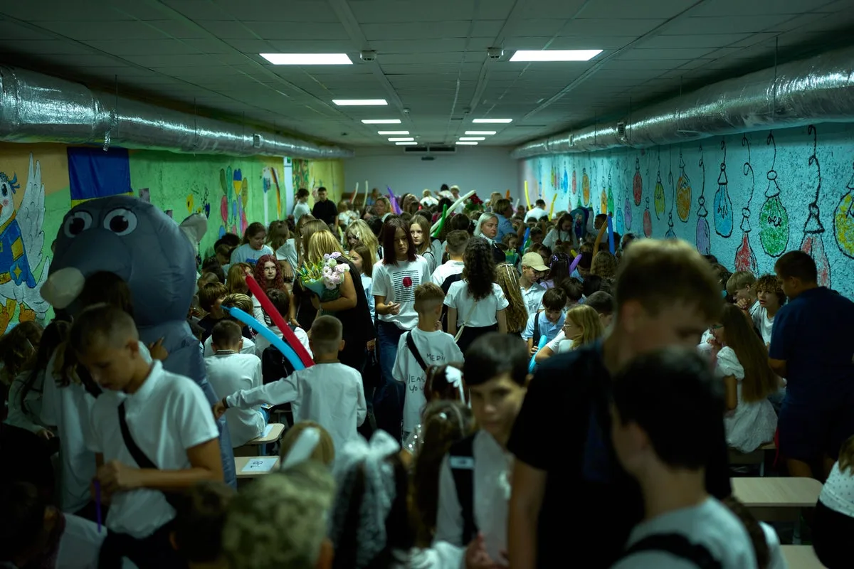 Ukraine’s children begin school year with balloons and missiles overhead