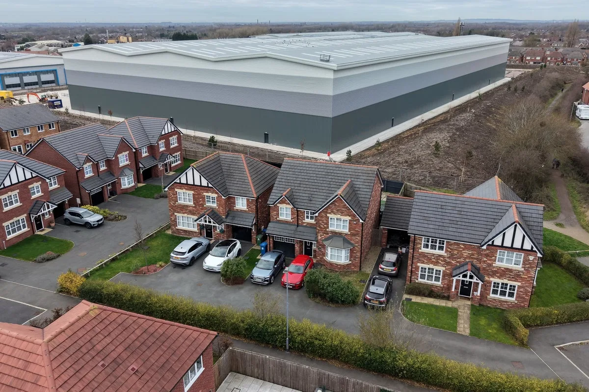 Neighbours thought 60ft warehouses towering over their homes were bad. The noise was worse