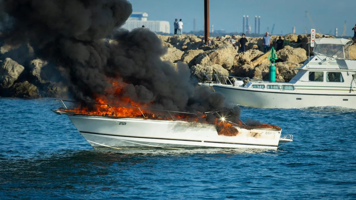 Emergency services respond to boat engulfed in out of control blaze at Fremantle’s Challenger Harbour