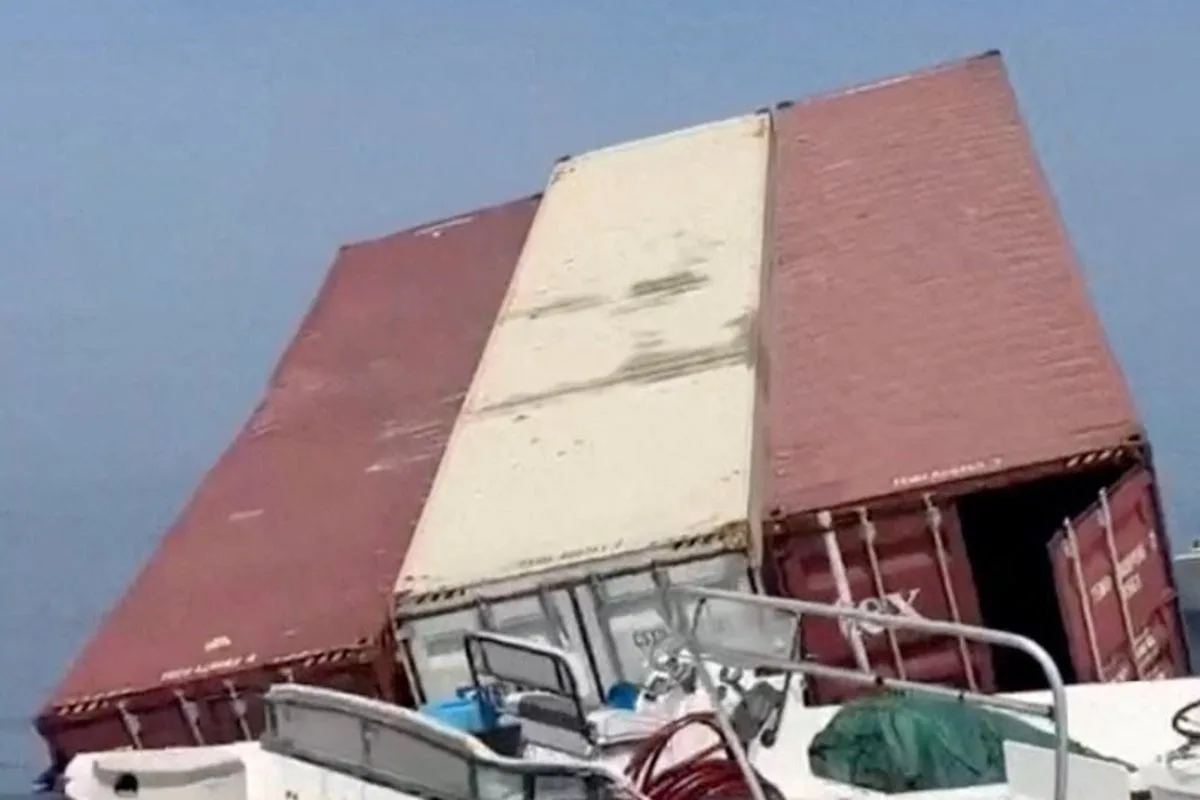 Pictures reveal huge cargo containers floating in Strait of Hormuz after Iran sinks two ships in day of violence