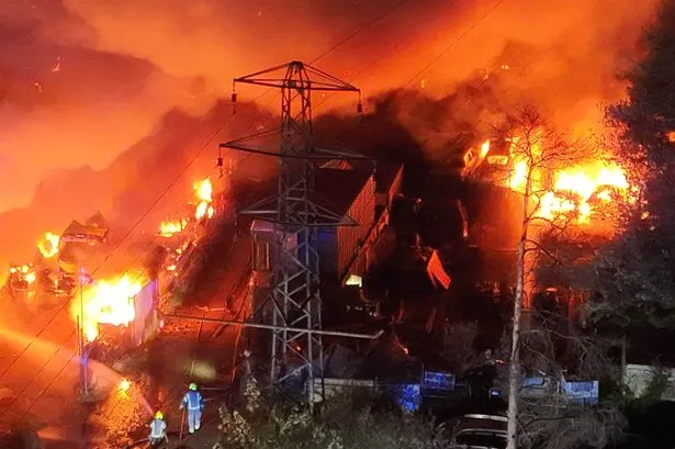 Cars destroyed in huge fire at parking site used by Gatwick Airport holidaymakers as thousands left without power