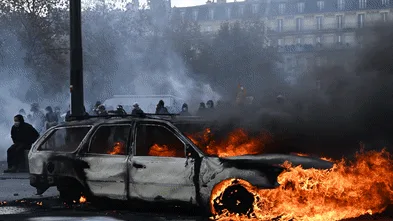 Police clash with protesters in France as tens of thousands rally over cost of living