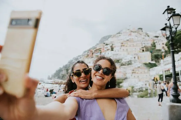 Warning issued over scammers who could use AI on holiday snaps