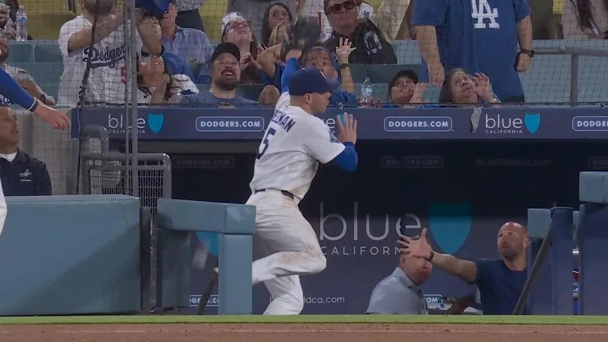 Dodgers’ Freeman leaves game after tumbling into Royals’ dugout