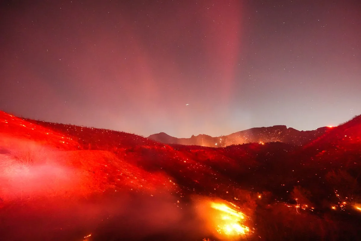Southern California homes engulfed in flames as multiple fast-moving fires rage