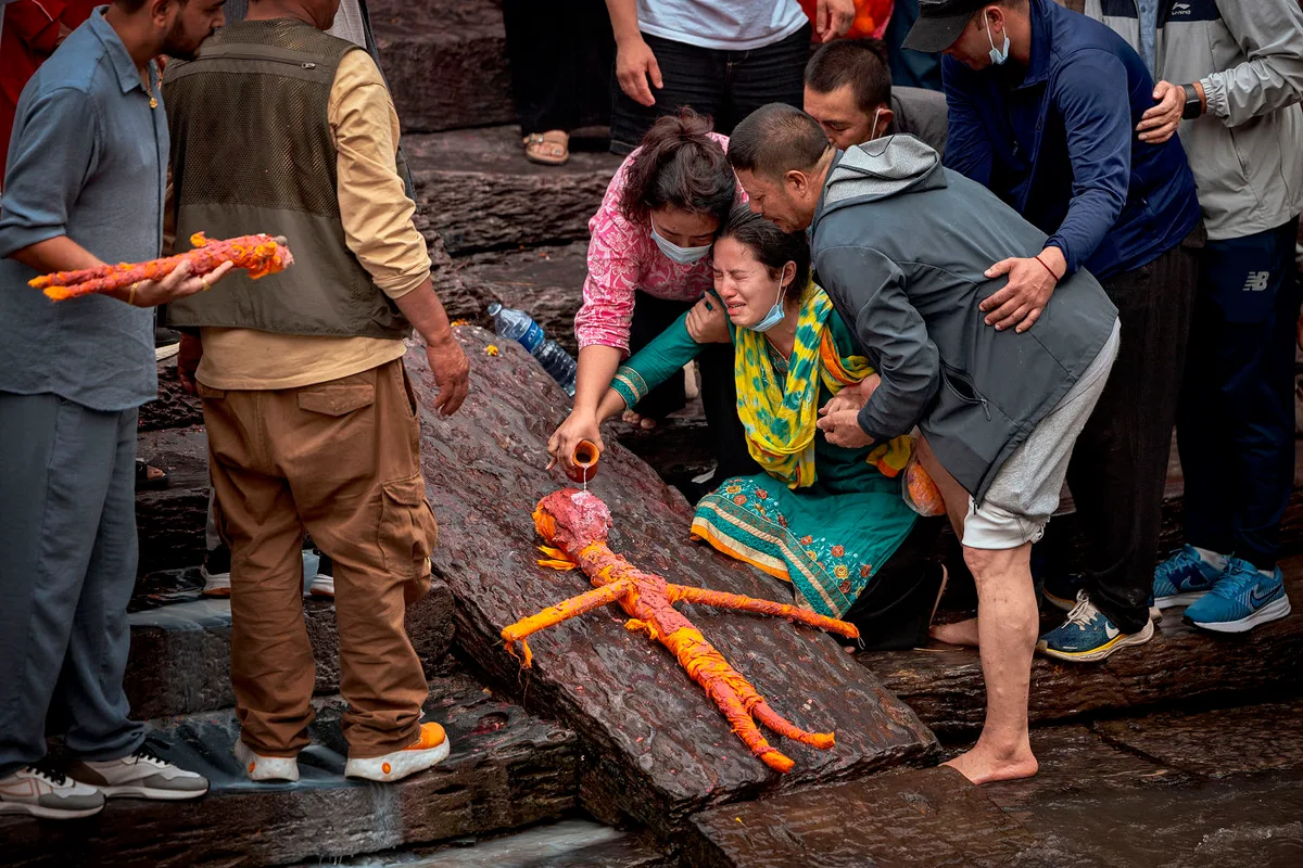 In Nepal, mourners hold symbolic cremation for missing loved ones