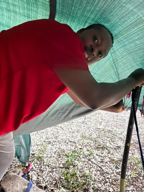 Watch: Refugees ordered to remove tarpaulins during rain at Durban park