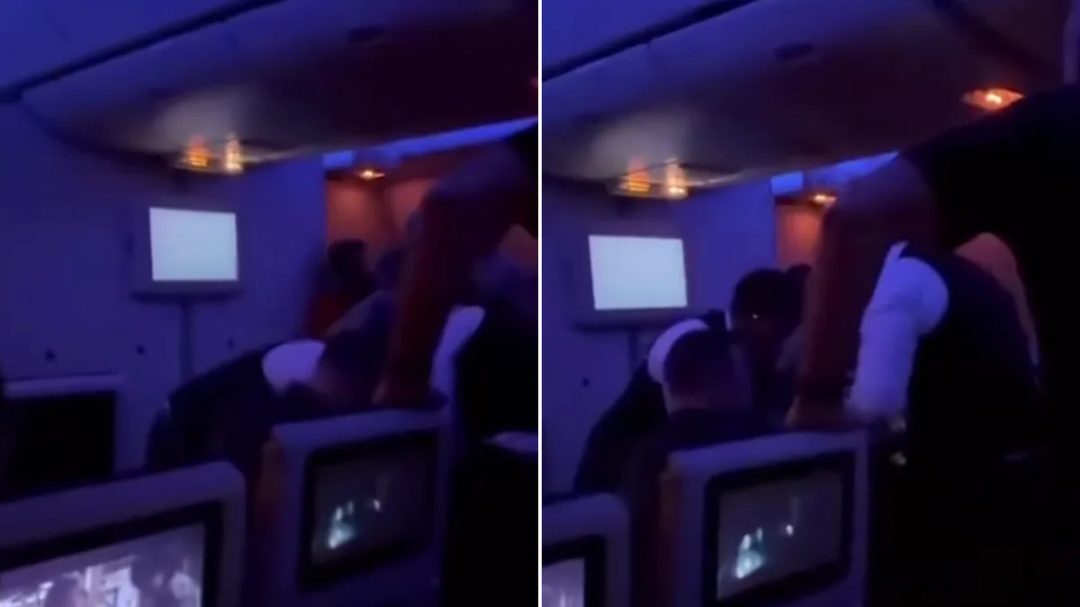 Passengers restrain two men claiming to have gun on Melbourne flight to the Middle East