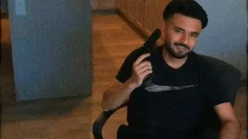 Alleged Bishnoi associate flaunts guns, bullets, cash in video obtained by CBC News