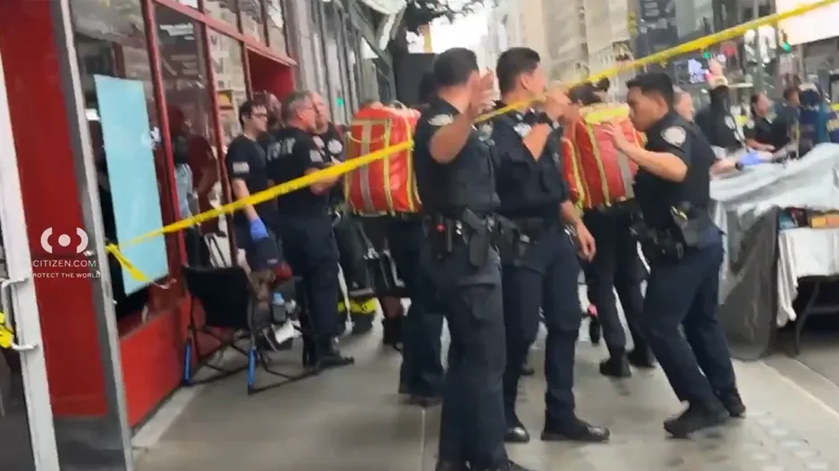 Knife-wielding woman accused of stabbing 2 in Times Square before being shot by police