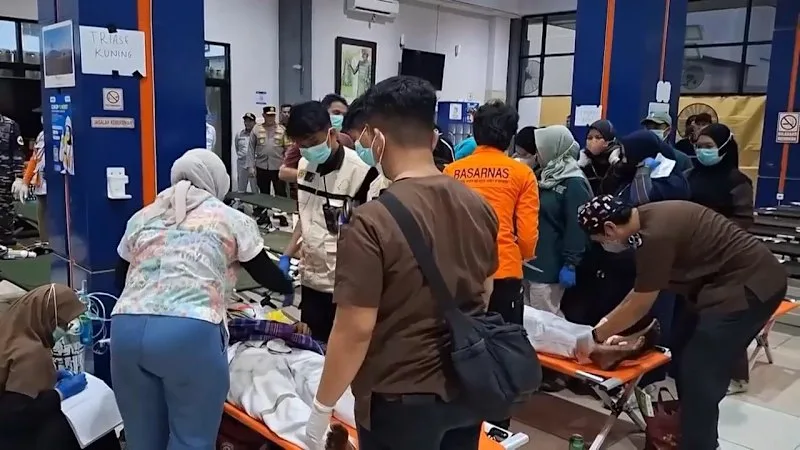 Dozens of rescued survivors from overturned ferry brought to Indonesian port