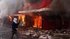 Violent clashes, looting and buildings ablaze in France as over 1,000 arrested after protests