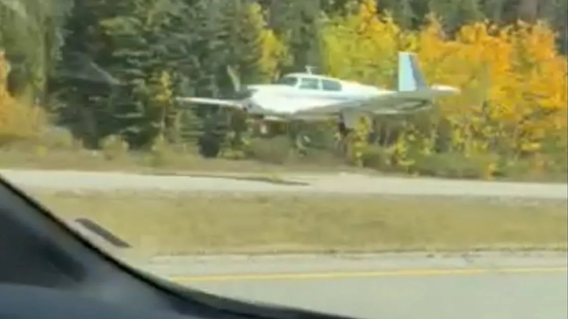 Plane lands on Highway 1 in Banff National Park