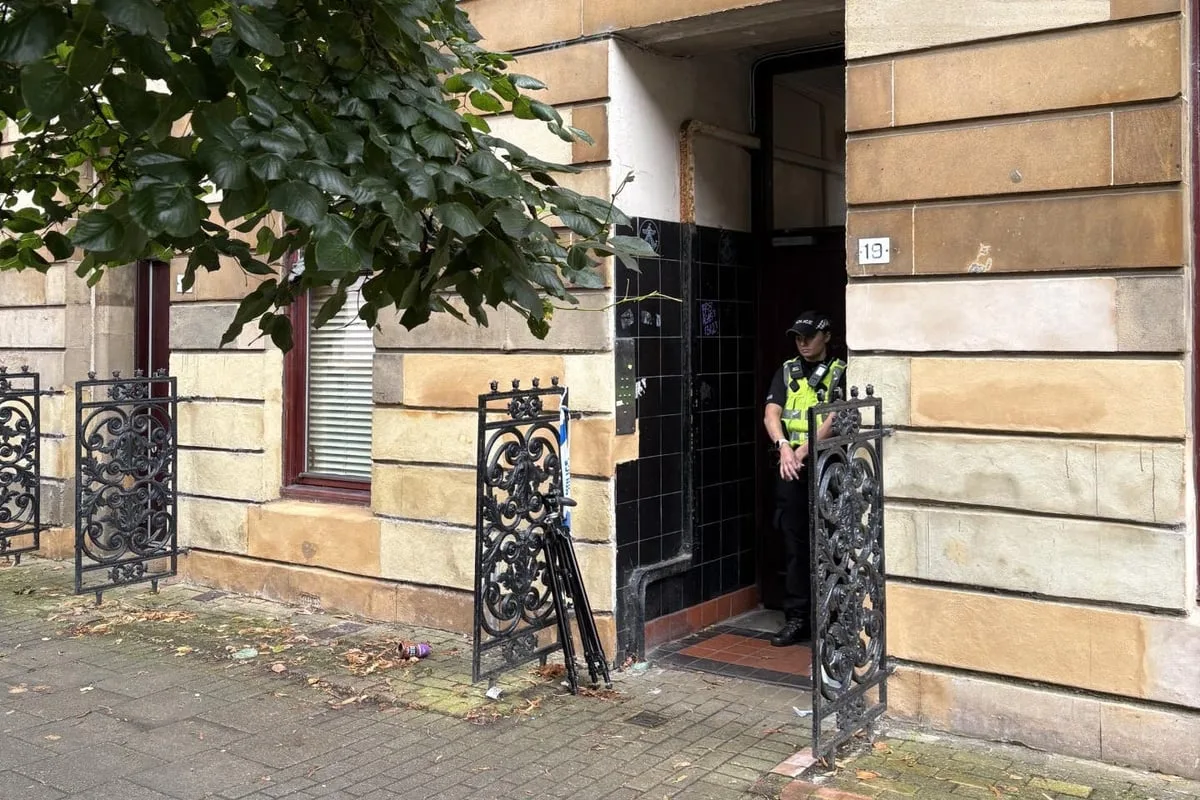 Double murder hunt launched after two men found dead in flat