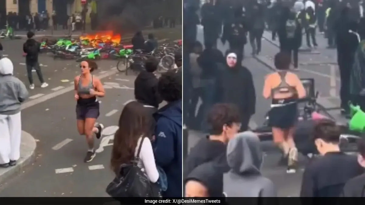 "Dystopian Fitness Video": Video Of Woman Jogging Amid France Protests Goes Viral Online