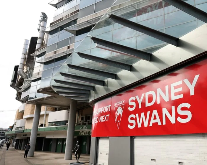 Third woman who joined Sydney Swans players in Melbourne hotel considers legal action after ‘entire world turned upside down’