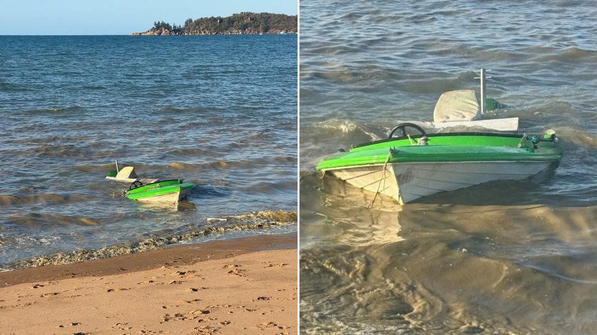 Mystery boat appears half submerged as police scramble to find owner