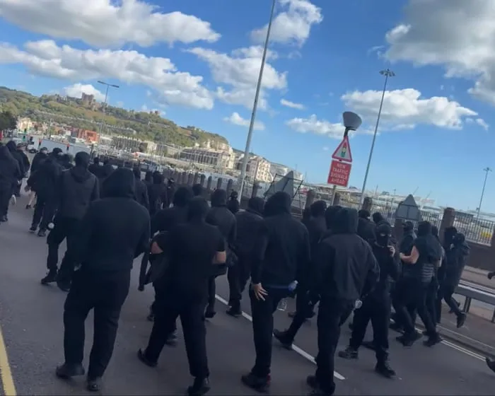 Black-clad Dover vigilantes will return if police do not act, say campaigners