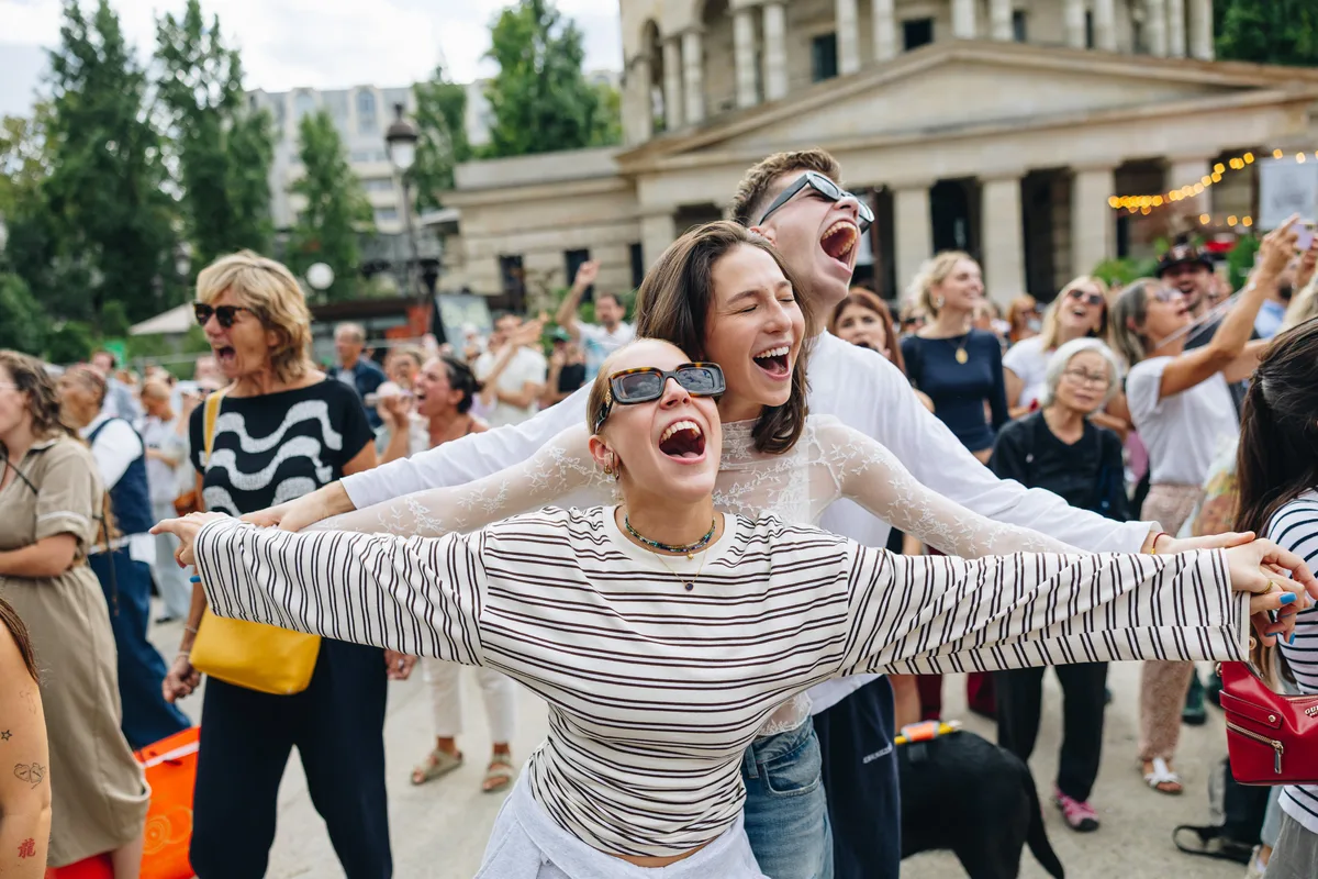 Thousands in Paris belt out Celine Dion tunes at outdoor karaoke event