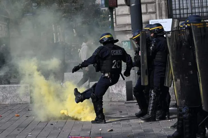 Scuffles break out as protesters rally across France, joining students