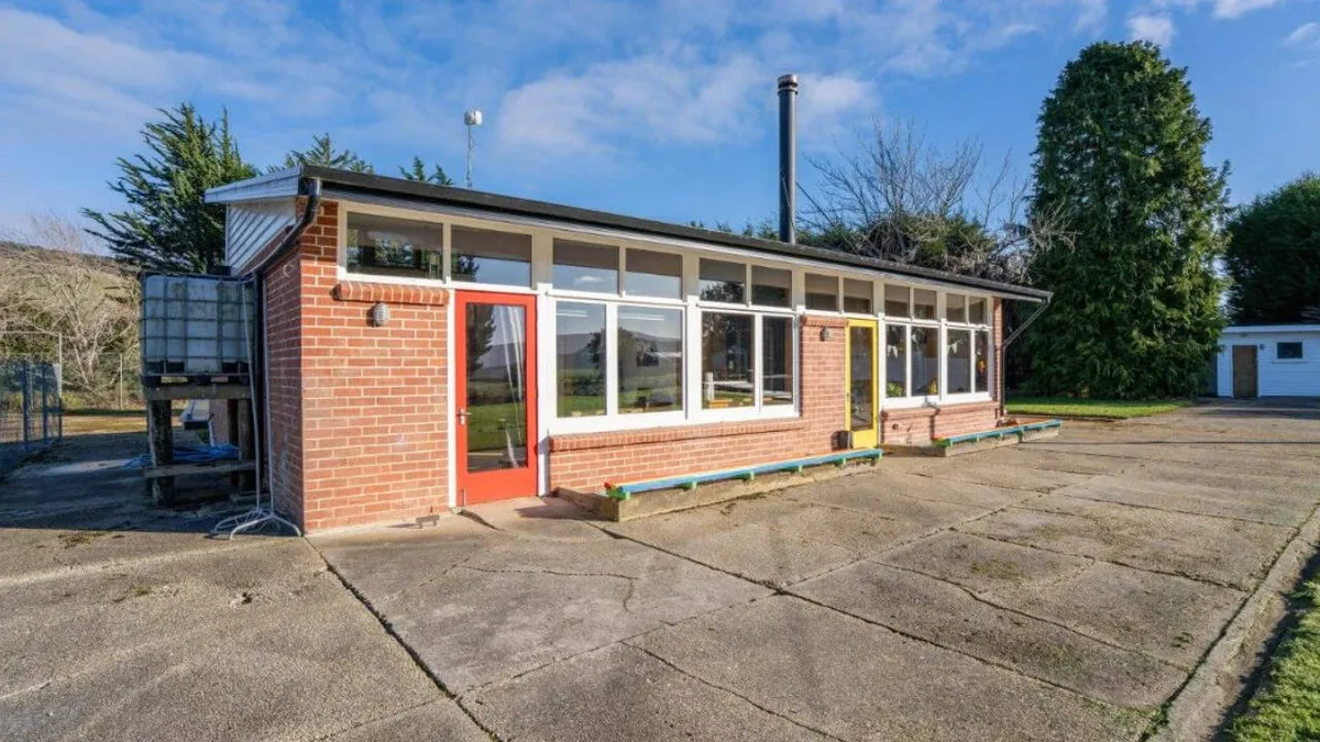 New Zealand couple turns old school into a home with a twist