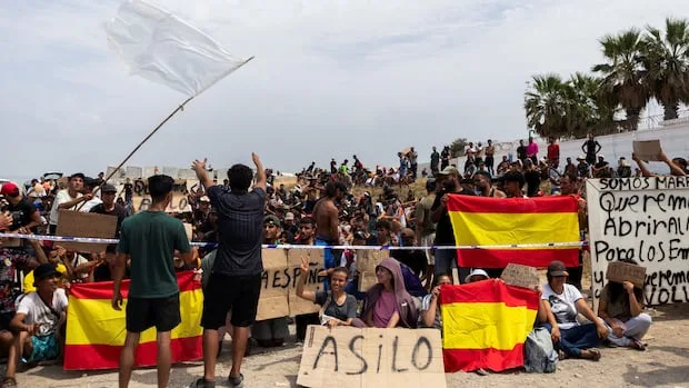 Hundreds of migrants in Spain's Ceuta enclave protest for asylum, against deportation to Morocco