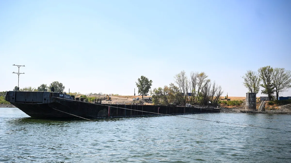 Hungary begins sinking barges to protect Paks nuclear power plant