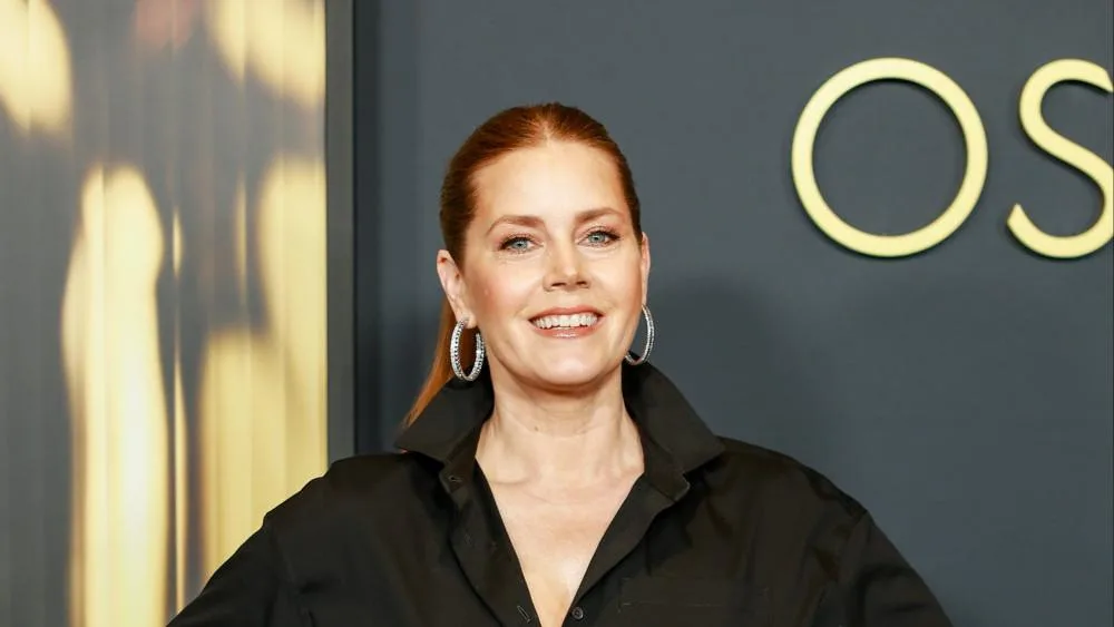 Amy Adams has to 'isolate' on set to keep 'golden retriever' personality at bay