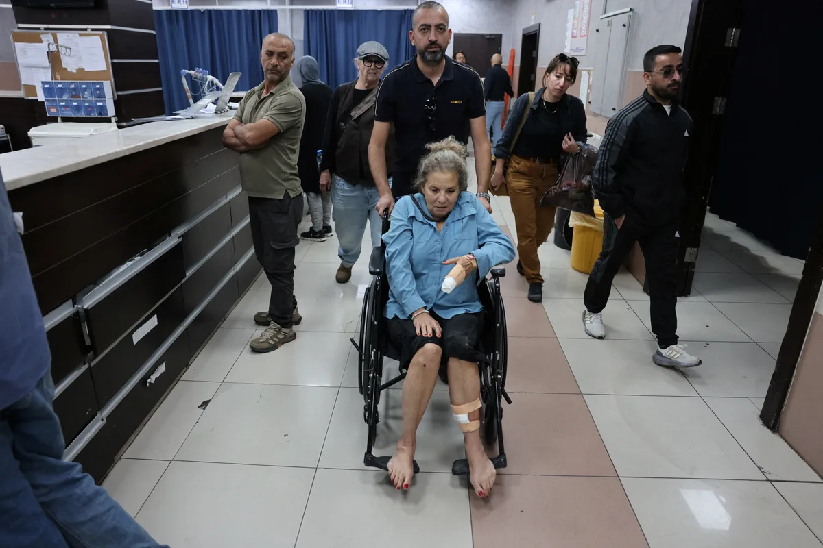 Israeli settlers beat Palestinians and a U.S. photojournalist in West Bank attacks