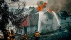 Fast-moving California wildfire burns homes as people are ordered to leave