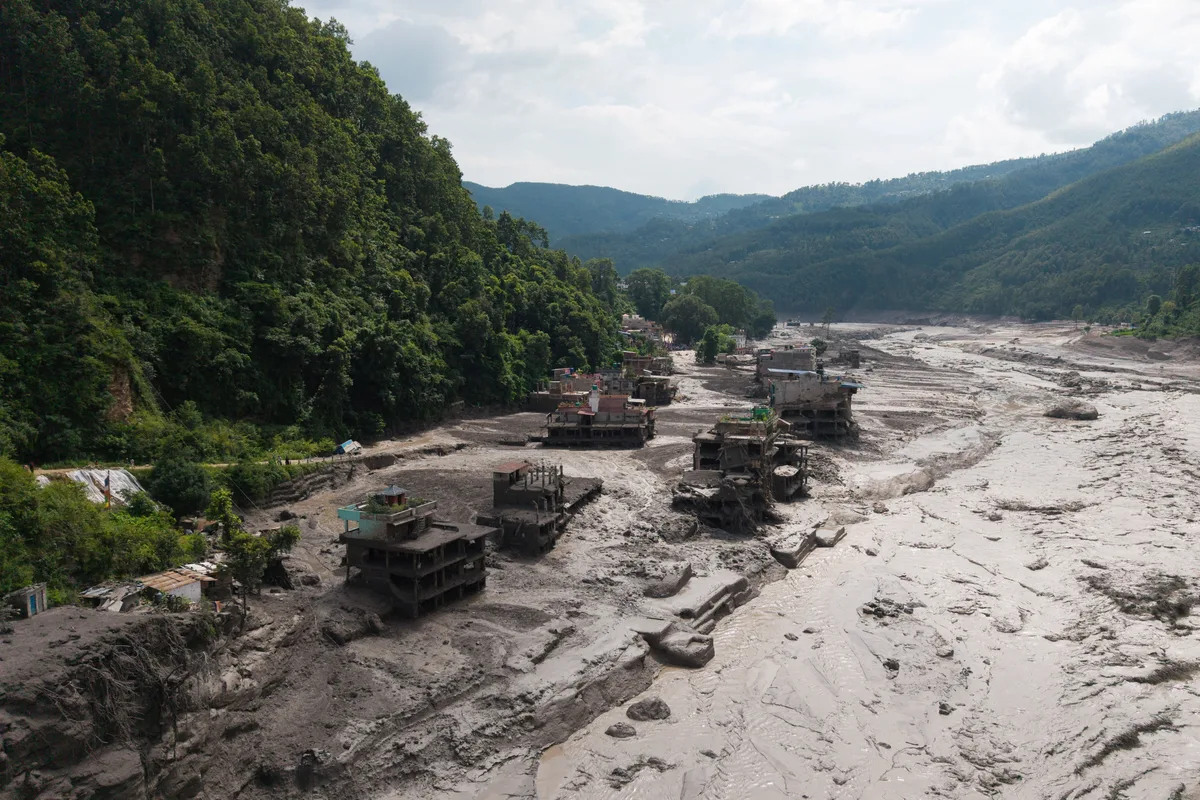 What caused the catastrophic flooding on the Nepal-Tibet border?