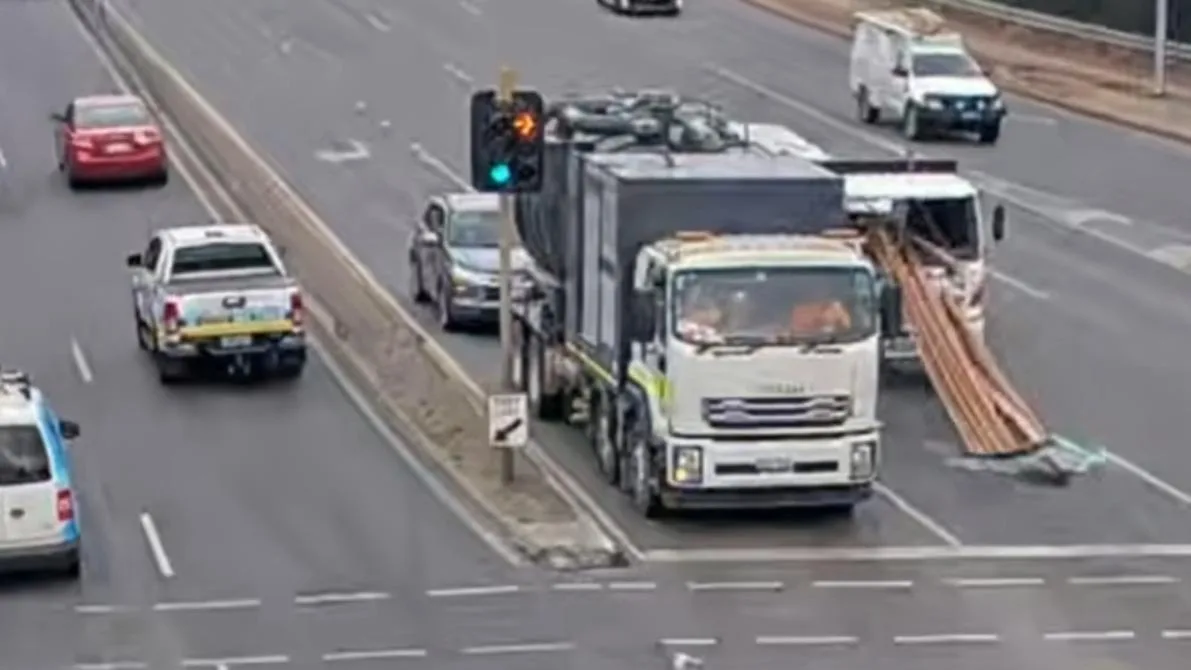 Truckie escapes injury after timber plank impales vehicle at busy Adelaide intersection