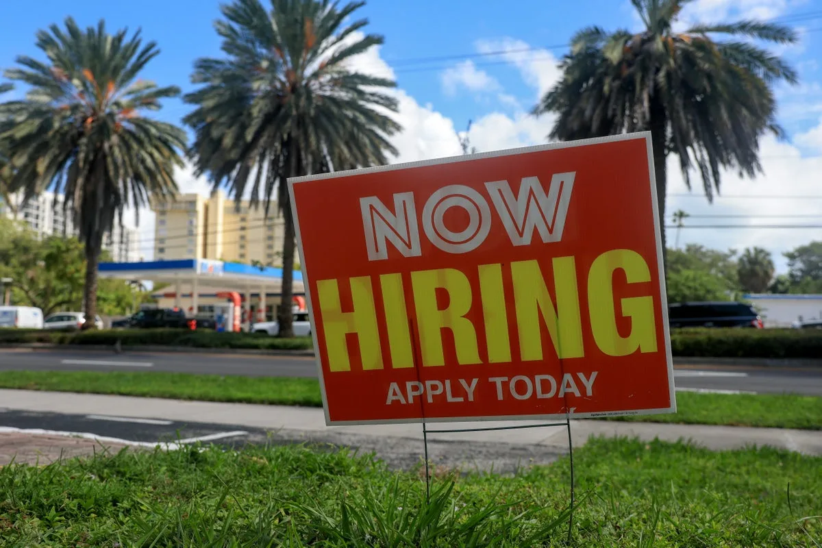 US jobless claims slips to 203,000 as layoffs remain low