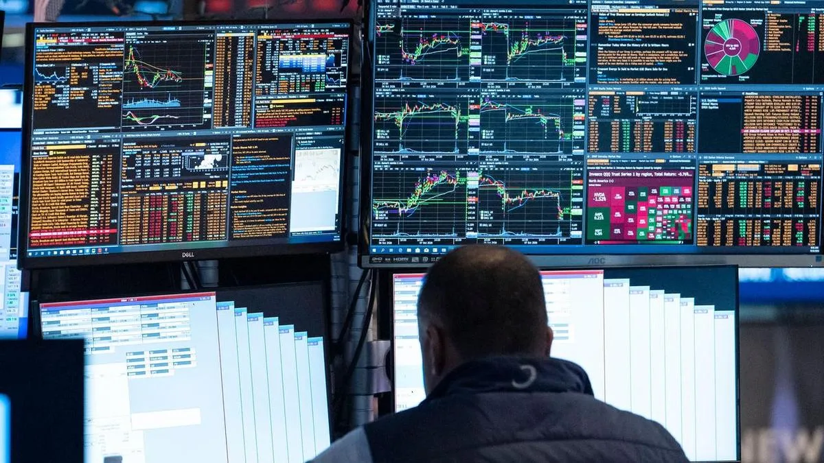 Wall Street opens higher as price of oil slips