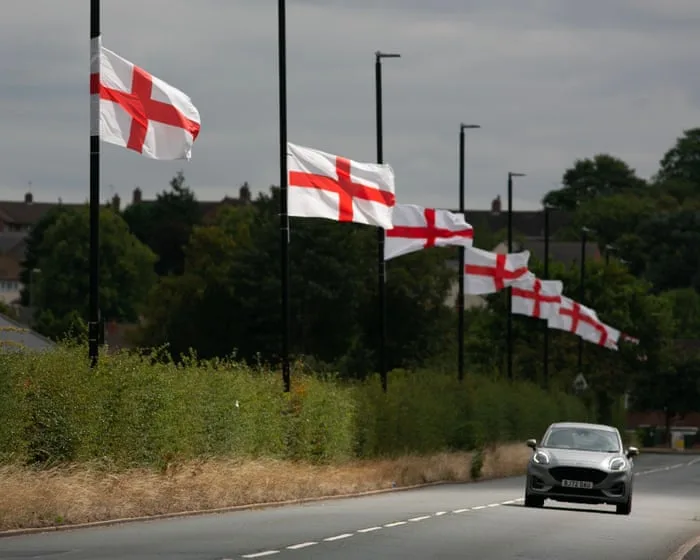 Birmingham seeks injunction to stop anti-migrant group erecting flags on infrastructure