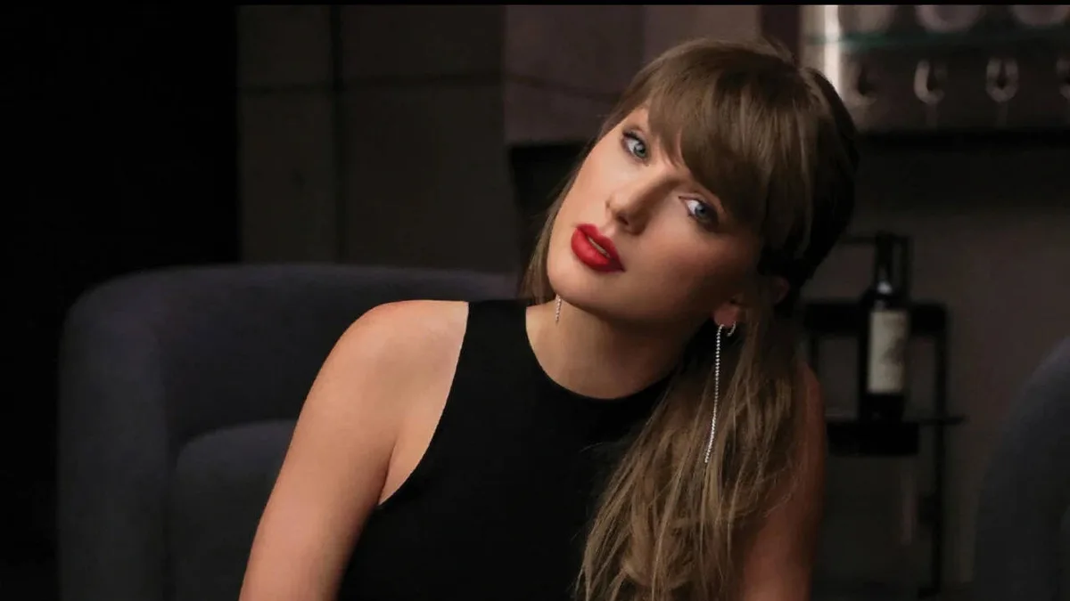 Taylor Swift dances along while cheering on Travis Kelce's team