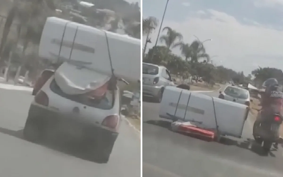 Geladeira e colchão amarrados no teto de carro caem no meio da rua; vídeo