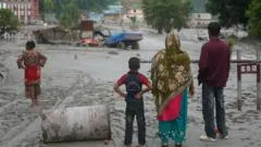 King 'heartbroken' by floods as search for missing, including 33 from UK, continues