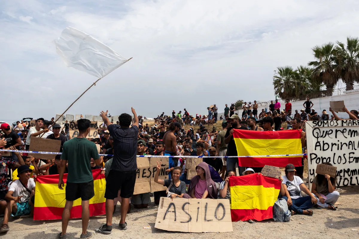Hundreds of migrants in Ceuta protest for asylum
